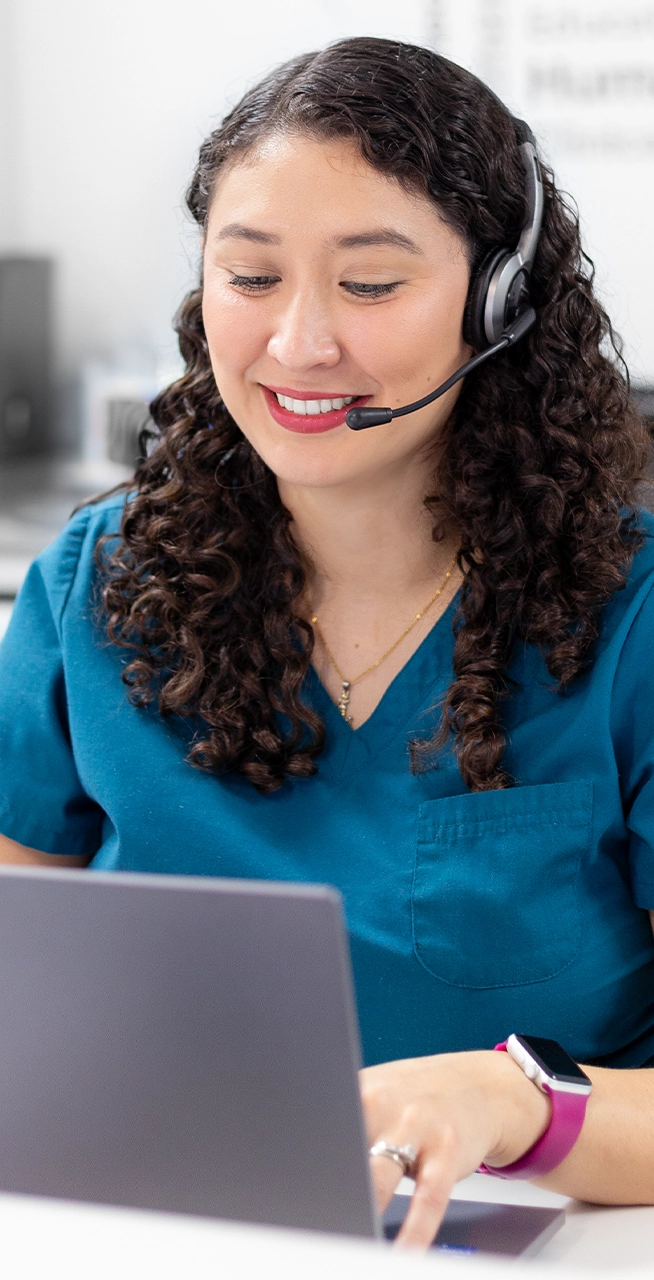 Girl attending customer on the phone at Yuma Best Healthcare